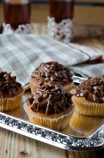 Cupcakes with chocolate cream — Stock Photo, Image