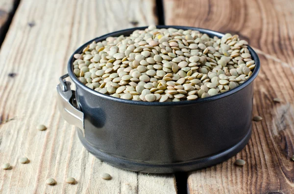 Green lentils in a bowl — Stock Photo, Image