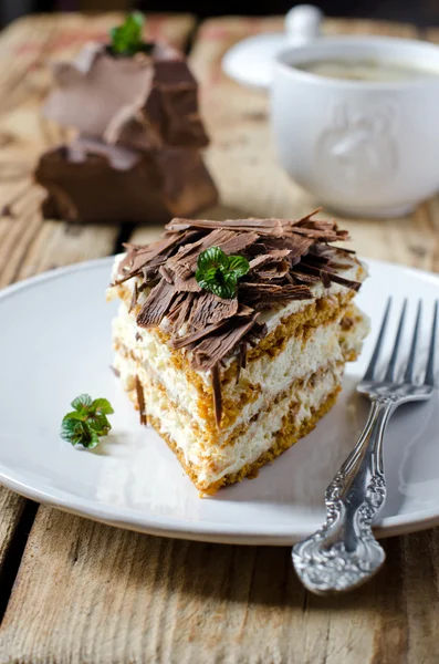 Sponge cake with cream and chocolate — Stock Photo, Image