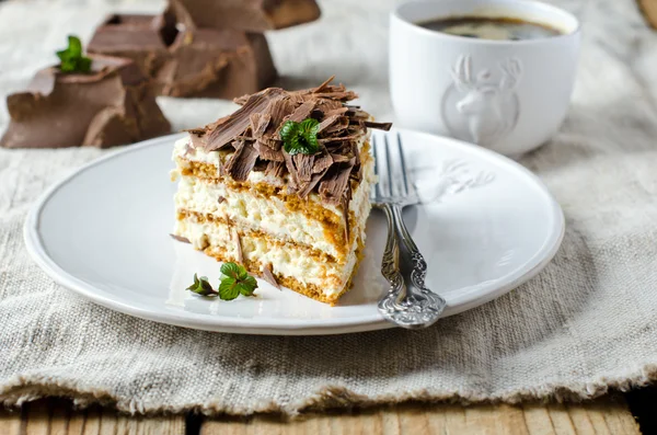 Sponge cake with cream and chocolate — Stock Photo, Image