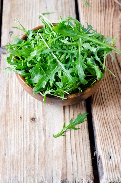 Fresh arugula in a bowl — Stock Photo, Image