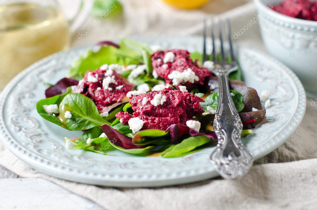 Beet salad with feta cheese and salad mix