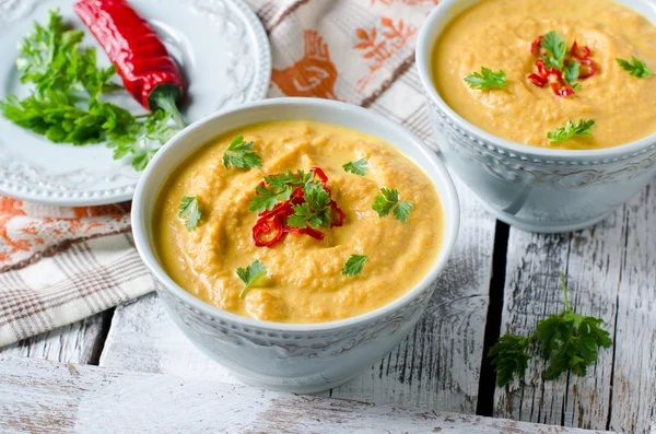 Carrot cream soup with red chili pepper — Stock Photo, Image