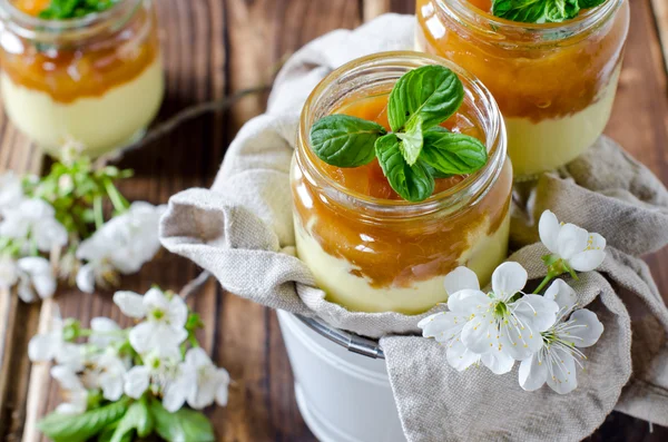 Curd dessert with jam in a glass jar — Stock Photo, Image