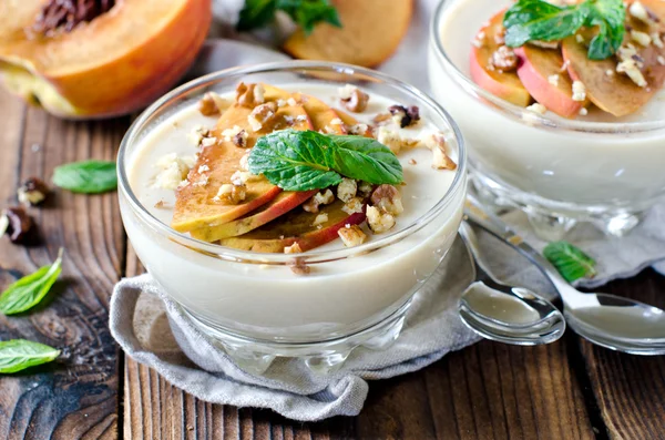 Peach mousse with nuts and mint — Stock Photo, Image