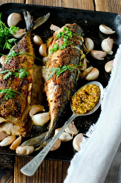 Mackerel baked with garlic and spices — Stock Photo, Image