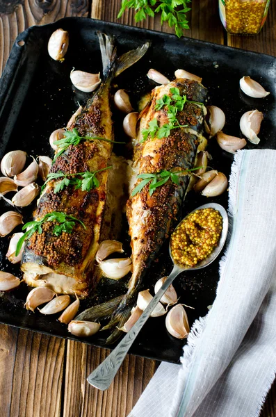 Mackerel baked with garlic and spices — Stock Photo, Image