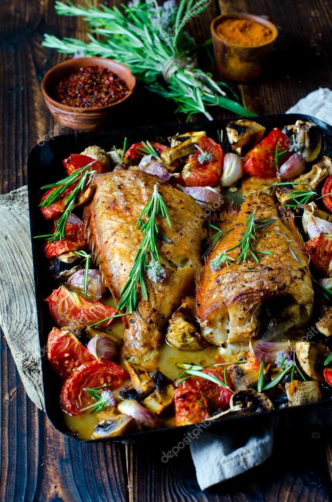 Baked sea bass with vegetables and herbs — Stock Photo © teleginatania