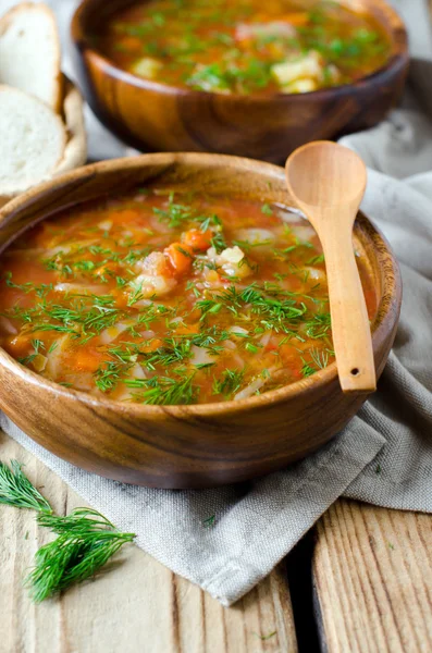 Borsch in a wooden bowl — Stock Photo, Image