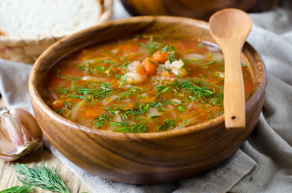 Borsch in a wooden bowl — Stock Photo, Image