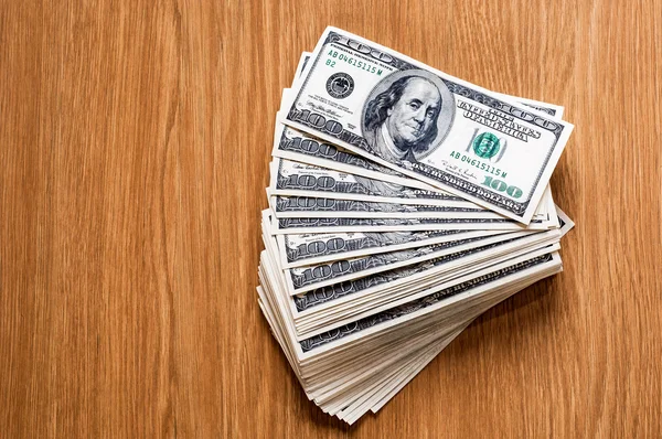 Pile of money over wood background — Stock Photo, Image