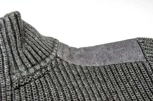 Närbild på grå tröja med axelvadd — Stockfoto