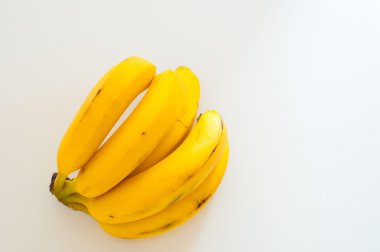 Fresh bananas on white background clipart