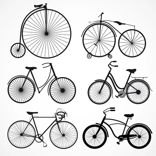 Conjunto de bicicletas em um fundo branco — Vetor de Stock