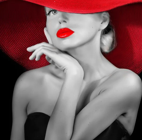 Edle Dame mit rotem Hut lizenzfreie Stockbilder
