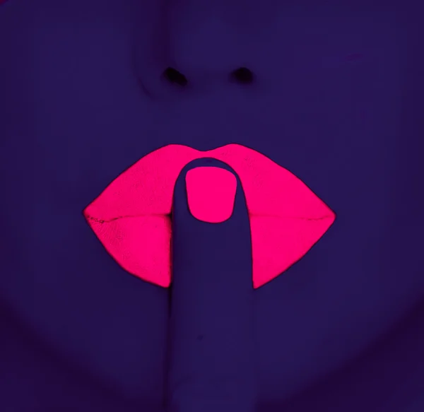 Finger on pink lips — Stock Photo, Image