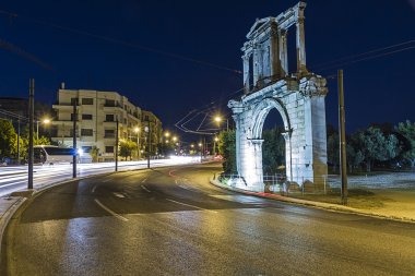 Adrianou Gate by night in Athens Greece clipart