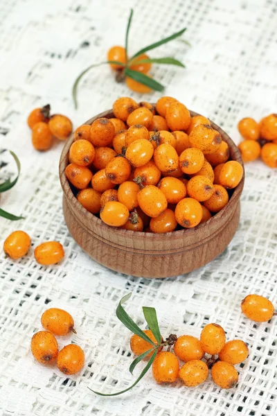 Image of ripe sea-buckthorn berries in wooden bowl — Stock Photo, Image