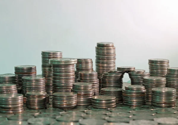 City made of coins, on gray background — Stock Photo, Image