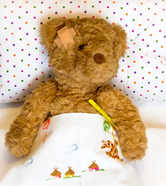 Ill teddy bear Stock Image