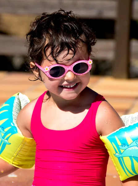 Little girl in a pool — Stock Photo, Image