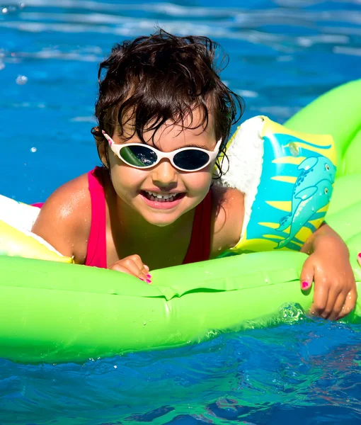 Little girl in a pool Royalty Free Stock Photos