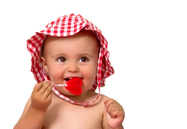 Bebê comendo pirulito — Fotografia de Stock