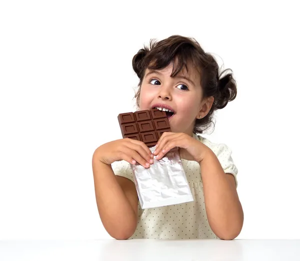 Criança comendo chocolate Fotografia De Stock