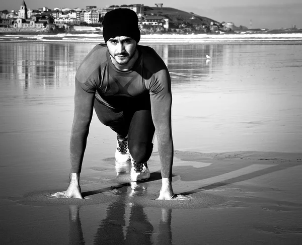 Athlete on beach — Stock Photo, Image