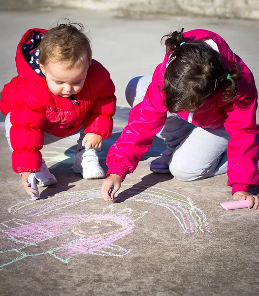 Little girls painting with chalk — Stock Photo, Image