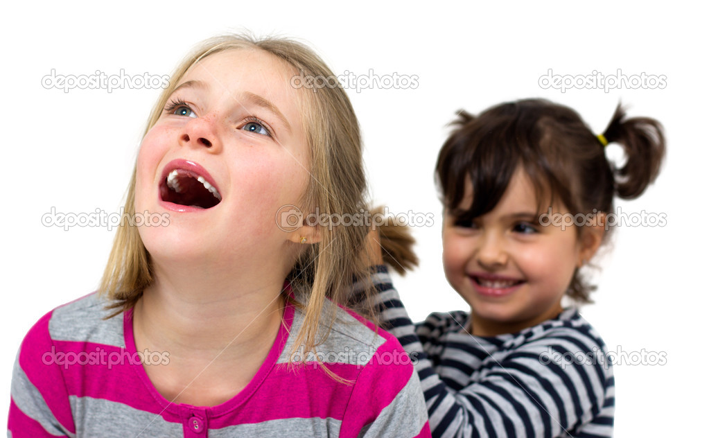 two little girls combing