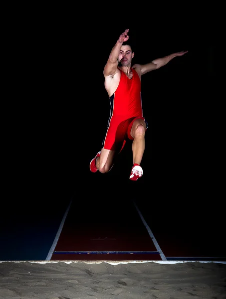 Atleta salto longo — Fotografia de Stock