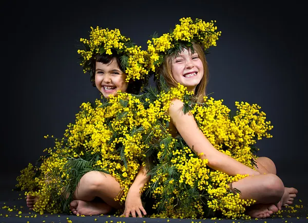 Little girls with floral dresses — Stock Photo, Image