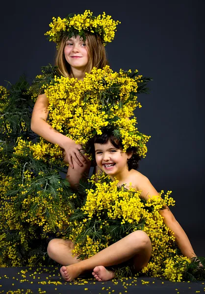 Little girls with floral dresses — Stock Photo, Image