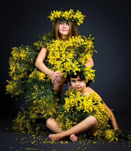 Little girls with floral dresses — Stock Photo, Image