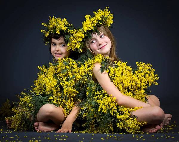 Little girls with floral dresses — Stock Photo, Image