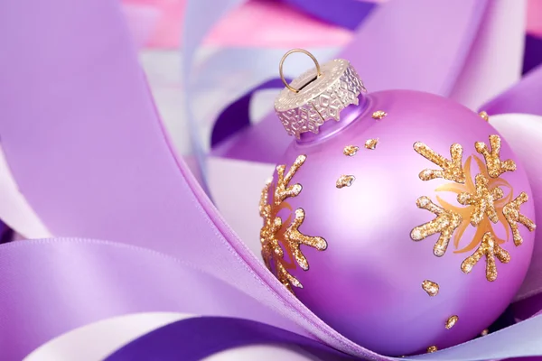 Christmas ball on ribbons — Stock Photo, Image