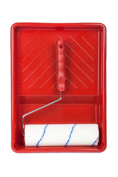 Paint roller and red tray. — Stock Photo, Image