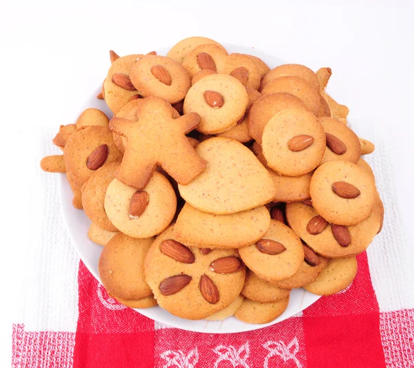 Pile of homemade biscuits isolated on white background. Christmas baking — Stock Photo, Image