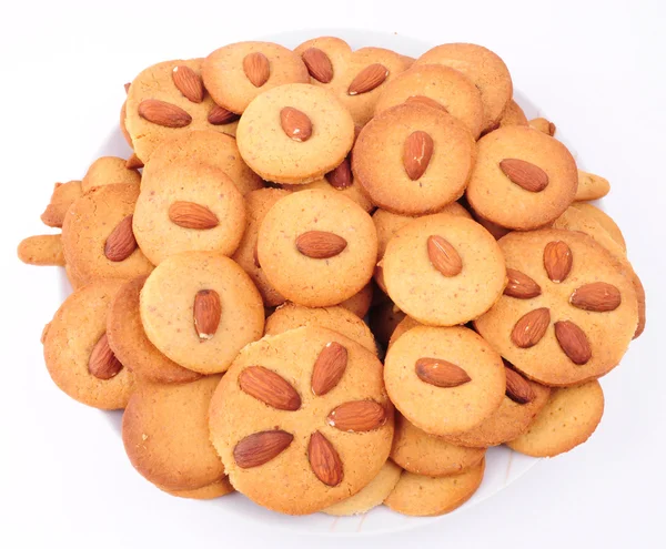 Pile of homemade biscuits isolated on white background. Christmas baking — Stock Photo, Image