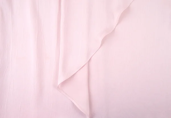 Licht roze zijden gordijn, achtergrond of textuur. roze zijde materiaal — Stockfoto