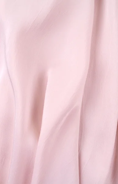 Licht roze zijden gordijn, achtergrond of textuur. roze zijde materiaal — Stockfoto