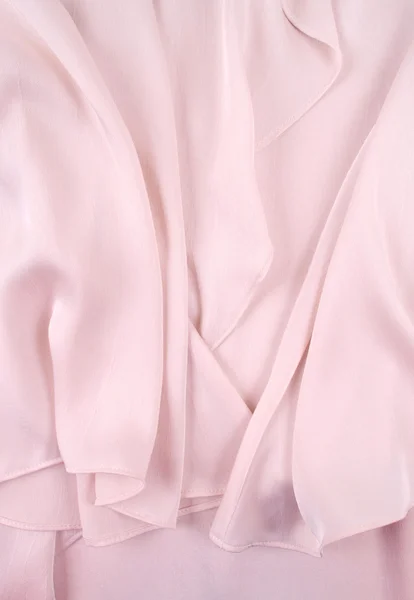 Светло-розовая шелковая драпировка, фон или текстура. Шелковый материал . — стоковое фото
