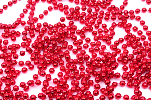 Christmas decoration. Red beads isolated on white background — Stock Photo, Image