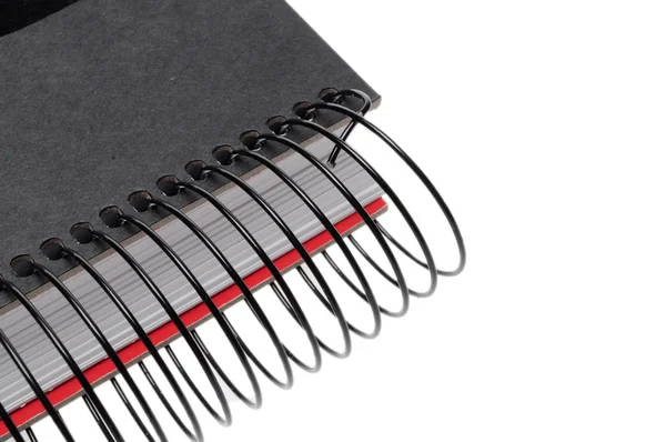 Zwarte spiraal notebook geïsoleerd op witte achtergrond — Stockfoto