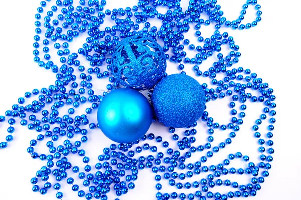 Sparkling Christmas balls and snowflake decorations on beads, isolated on white background — Stock Photo, Image
