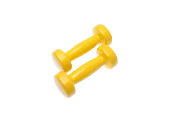 Pair of small yellow dumbbells Isolated on white background — Stock Photo, Image