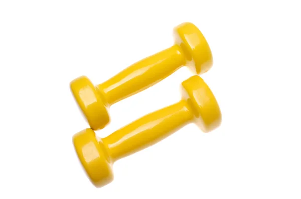Pair of small yellow dumbbells Isolated on white background — Stock Photo, Image