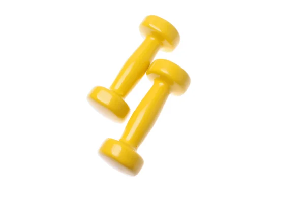 Pair of small yellow dumbbells Isolated on white background — Stock Photo, Image