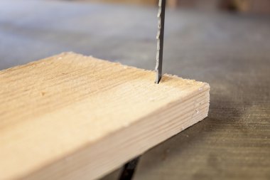Woodworking machine Band saw machine cutting planks clipart